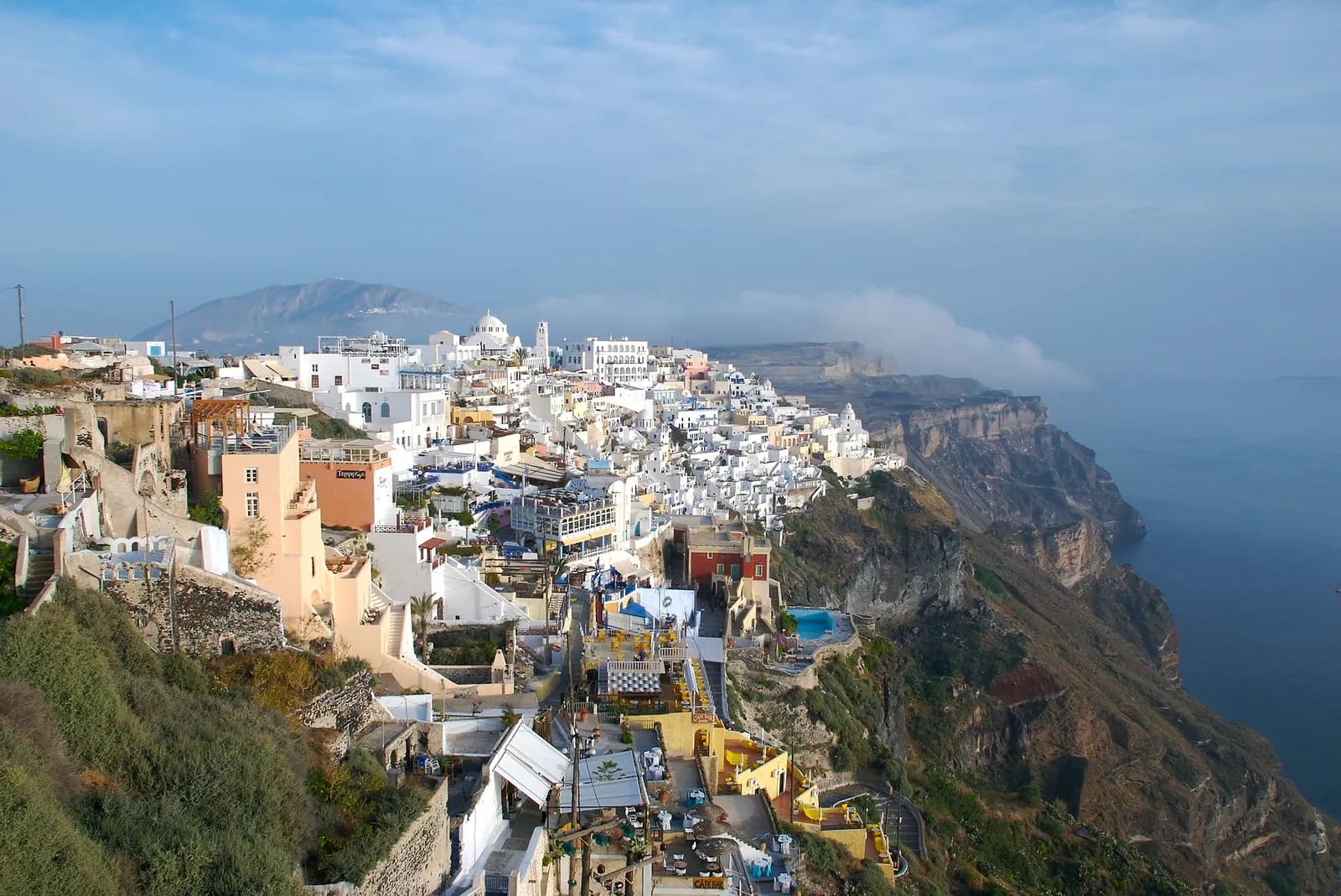 Fira and its colourful houses on the caldera edge, seen from the north