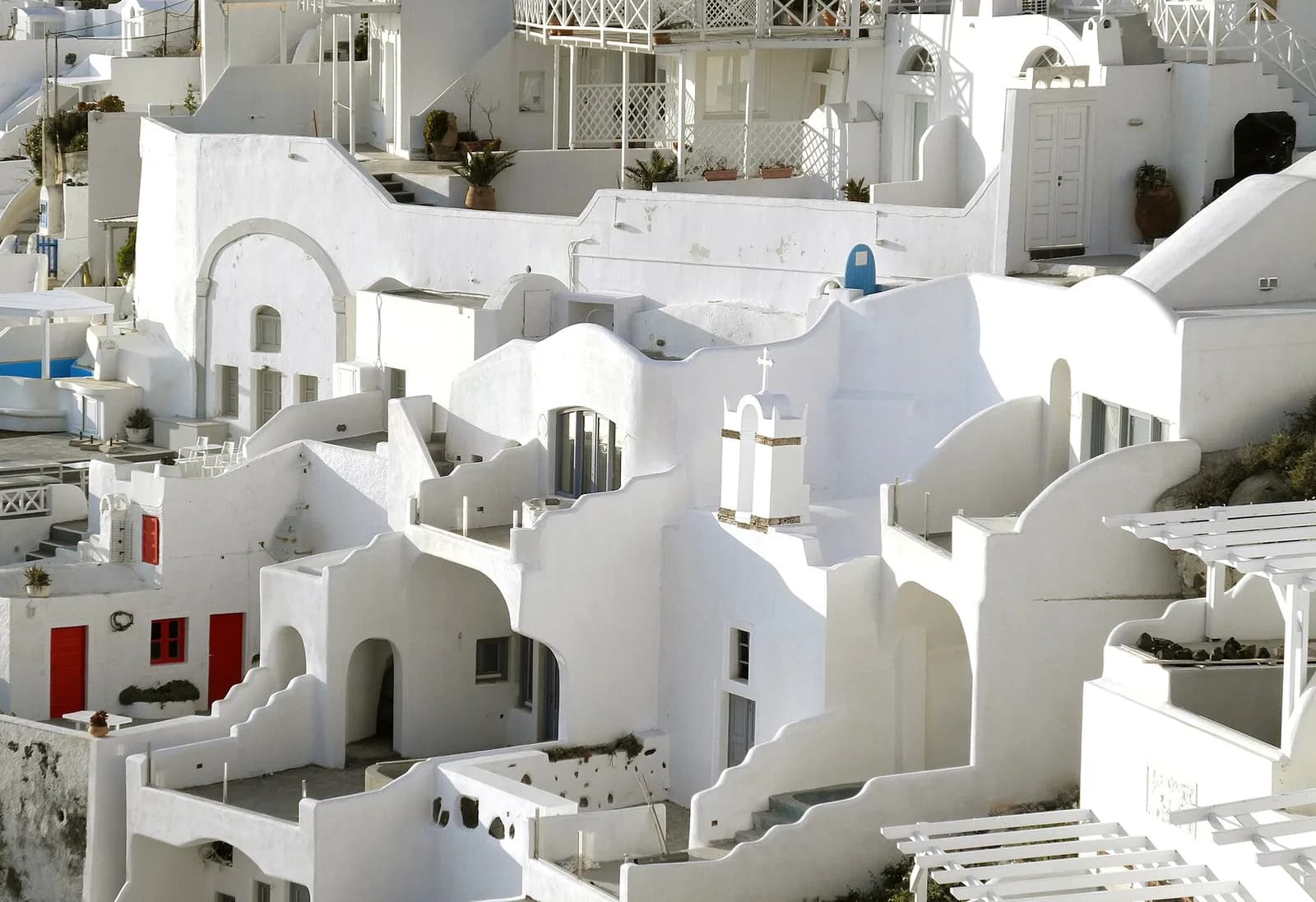 tiered white cave houses in Firostefani, the village next to Fira