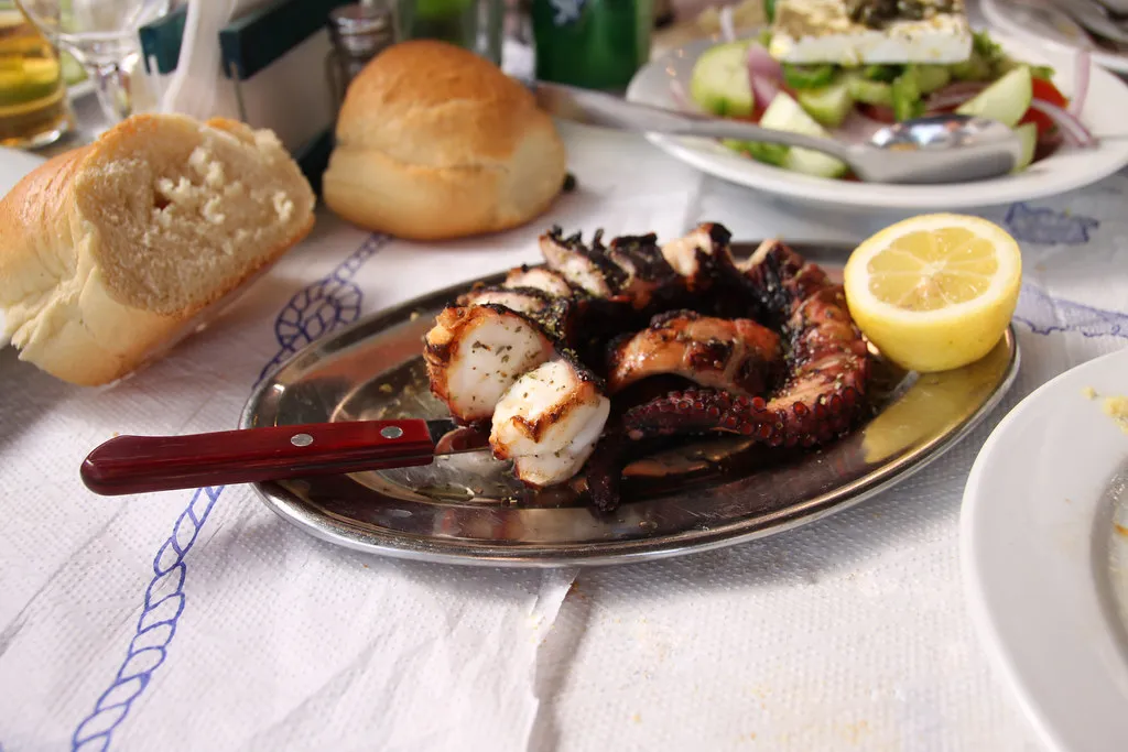 grilled octopus with lemon served in a Santorini taverna