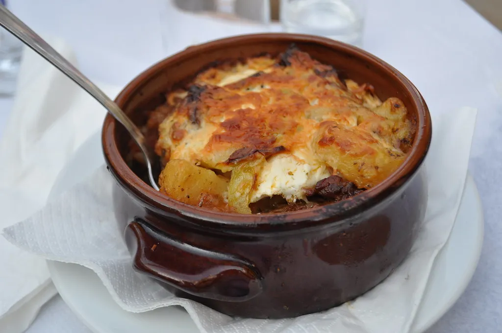 baked moussaka served in an individual earthenware dish