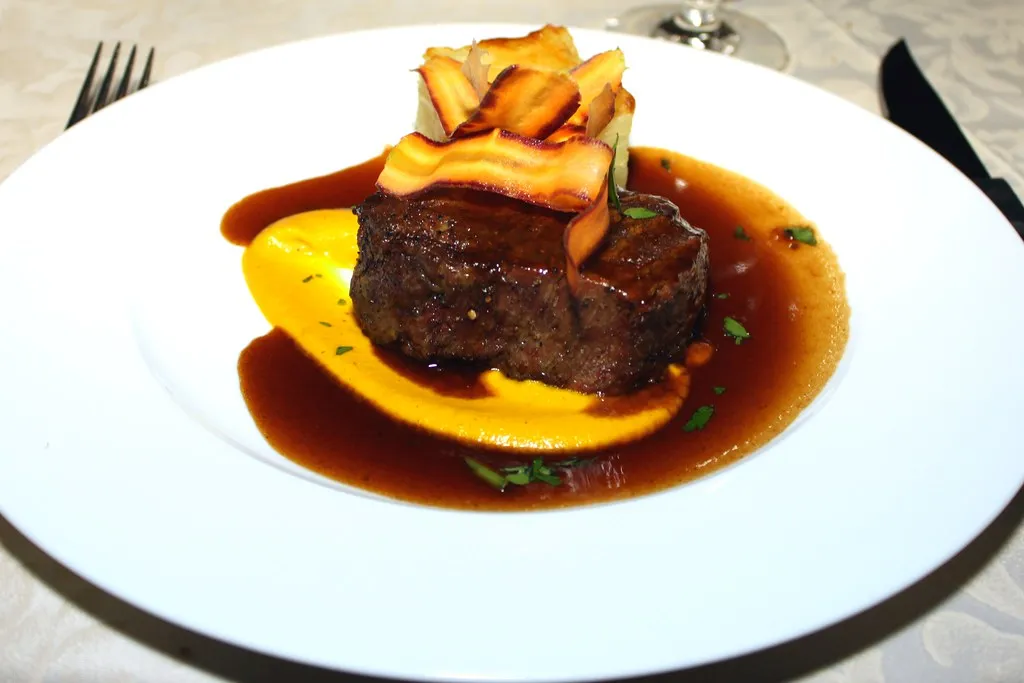 beef fillet with jus on a purée, plated as a fine-dining dish