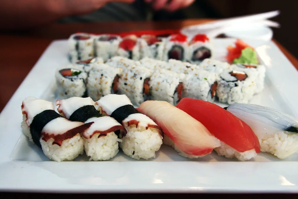 a platter of sushi and maki with tuna, octopus and white fish
