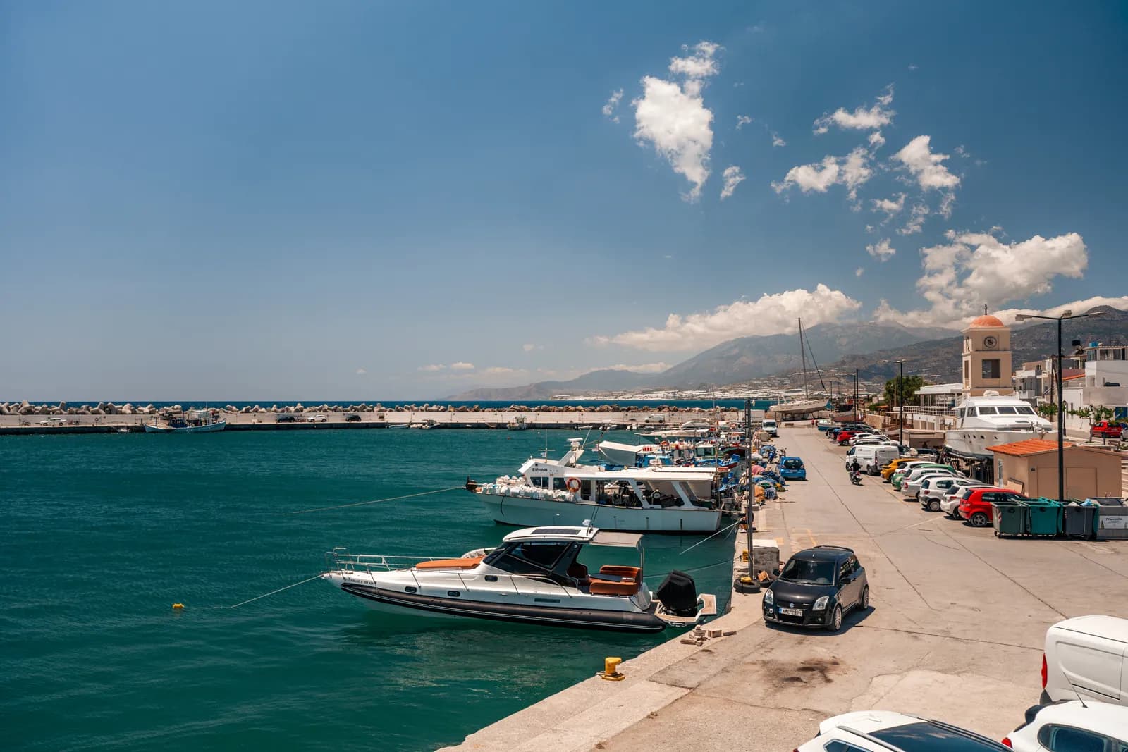 Boats moored along the quay of Ierapetra harbour, where trips to Chrissi depart