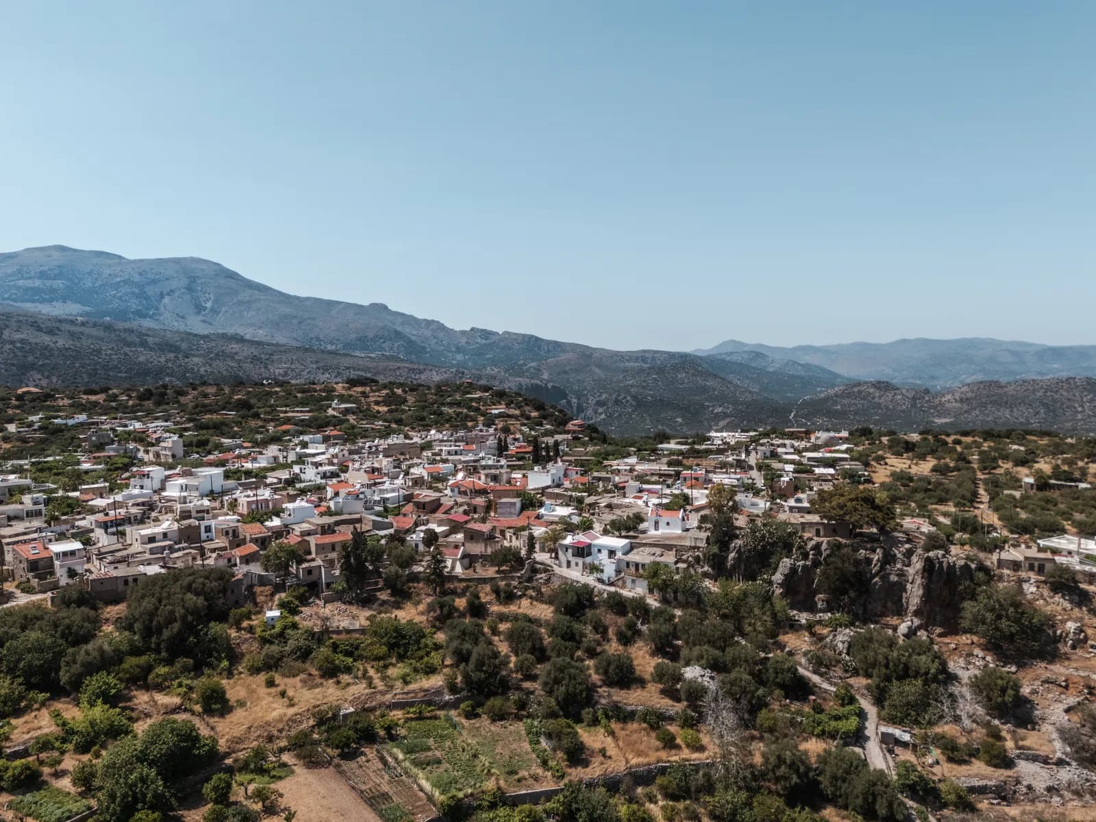 Aerial view of a Cretan village and its roads at the foot of the mountains in the south-east of the island