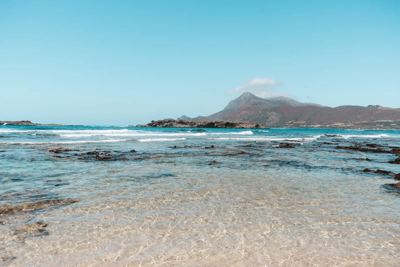 Crystal-clear water over flat rocks, at the northern end of Falassarna beach