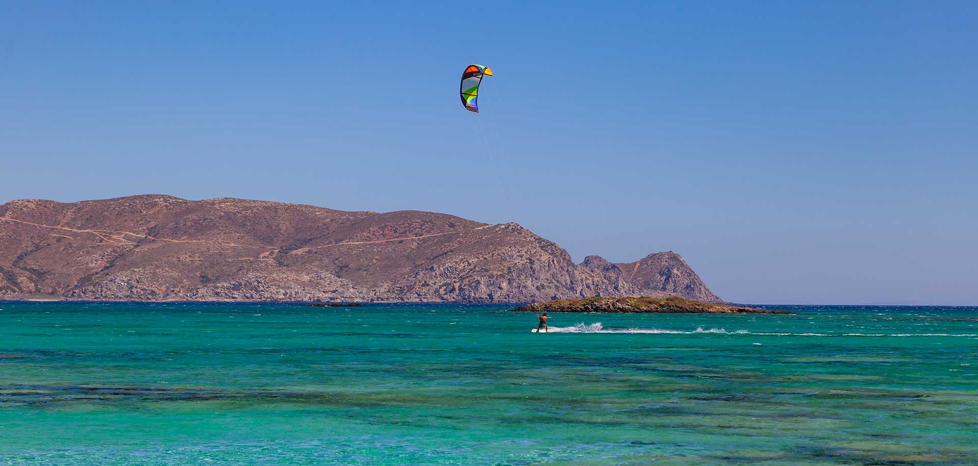 Kitesurfing at Elafonisi Beach, an ideal spot thanks to the constant winds on the west coast