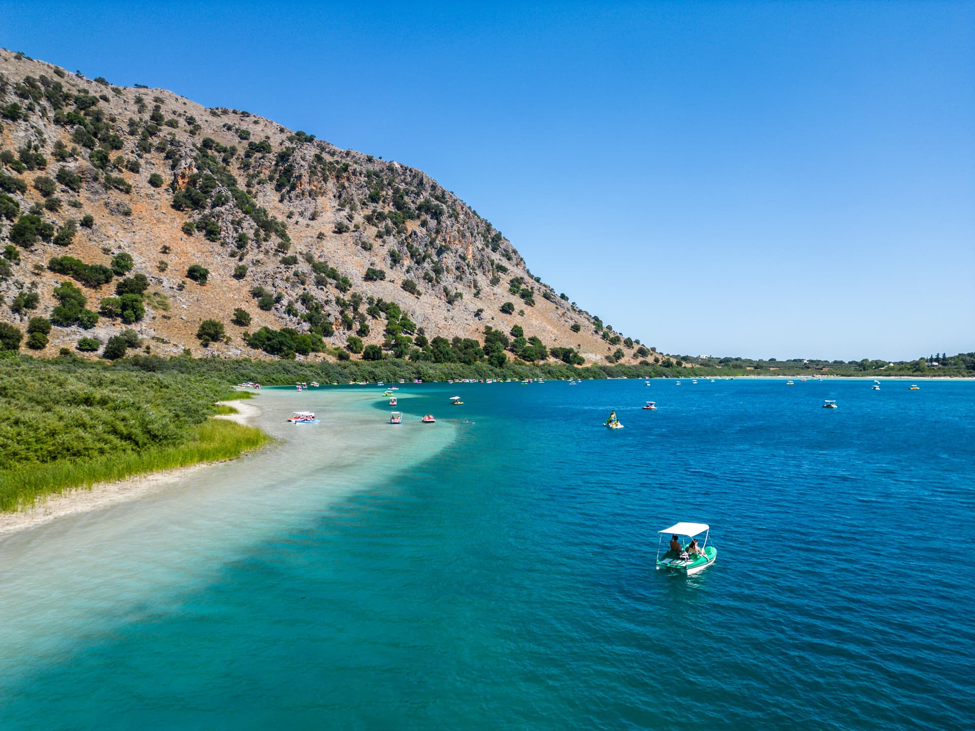 Lake Kournas landscape in spring with lush greenery