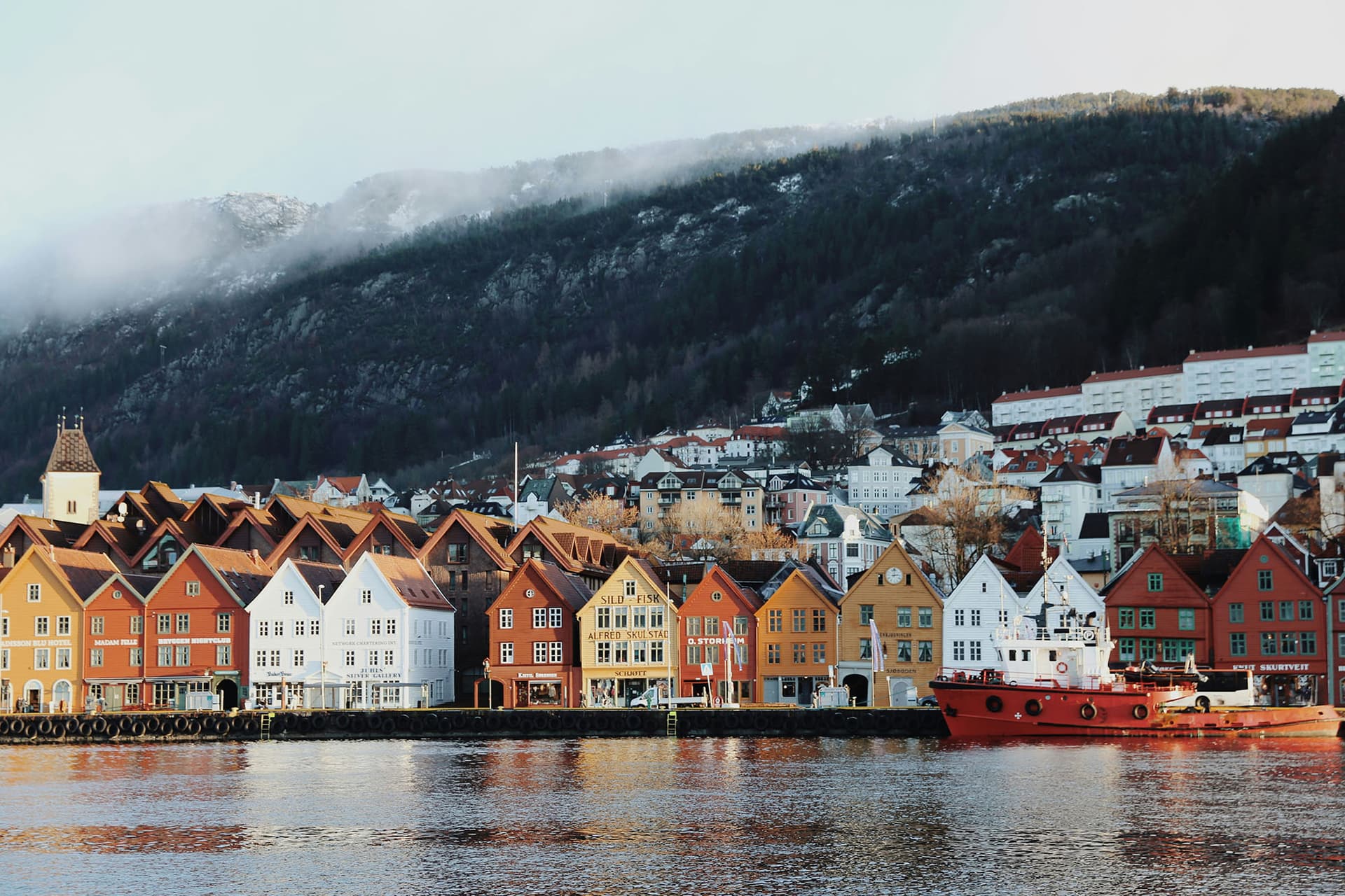 The colourful wooden houses of Bryggen in Bergen at the start of a one-week Norway itinerary