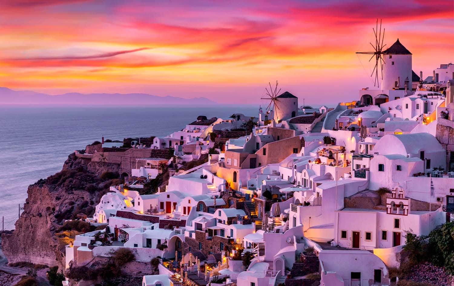 Golden sunset over the village of Oia and the Santorini caldera