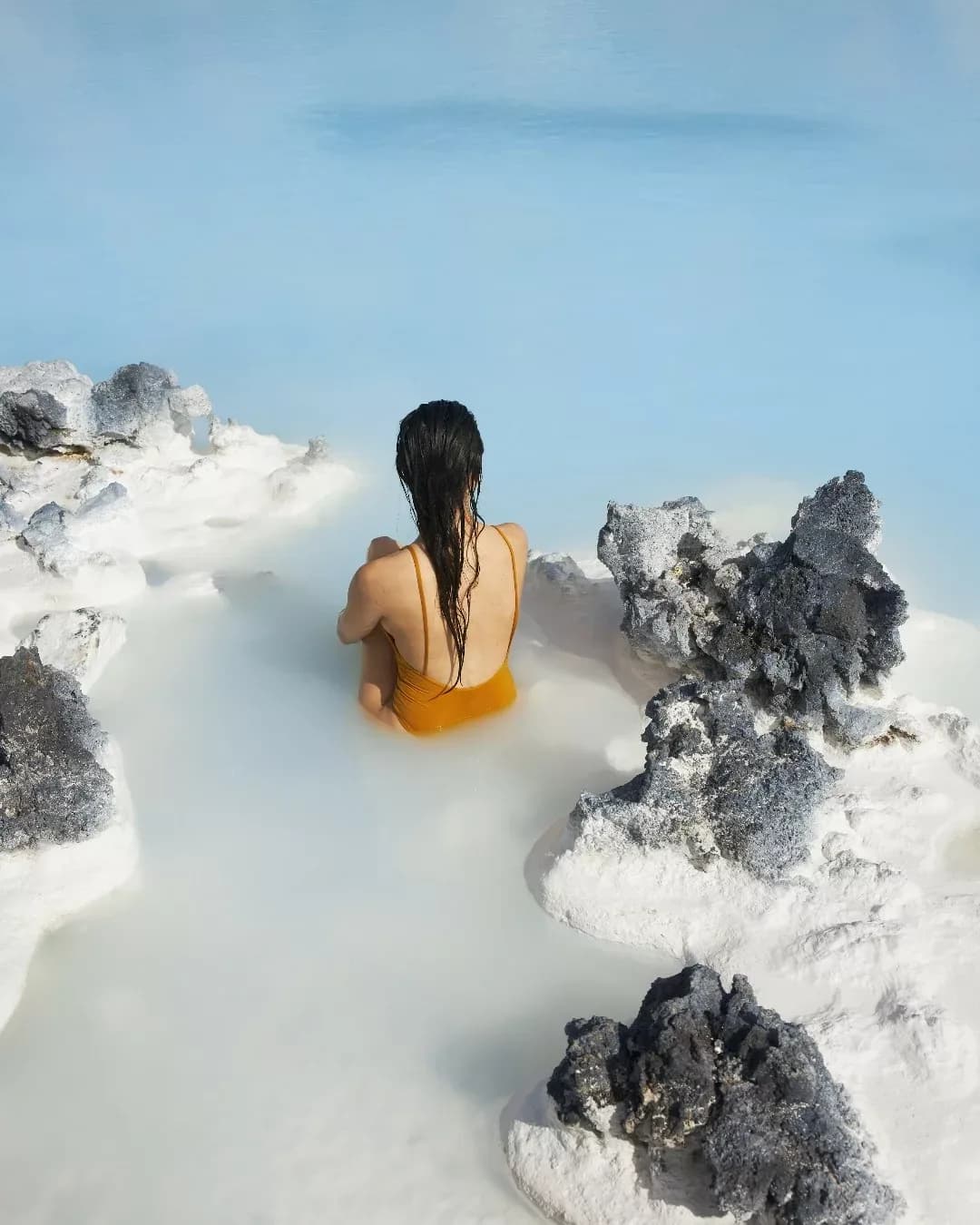 Visitors bathing in the milky blue waters of the Blue Lagoon