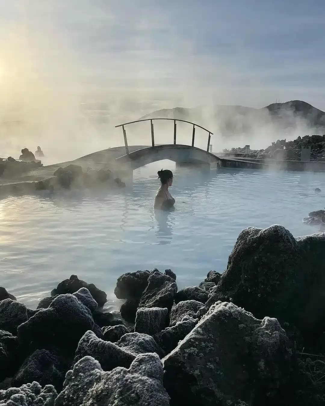Visitors bathing in the milky blue waters of the Blue Lagoon