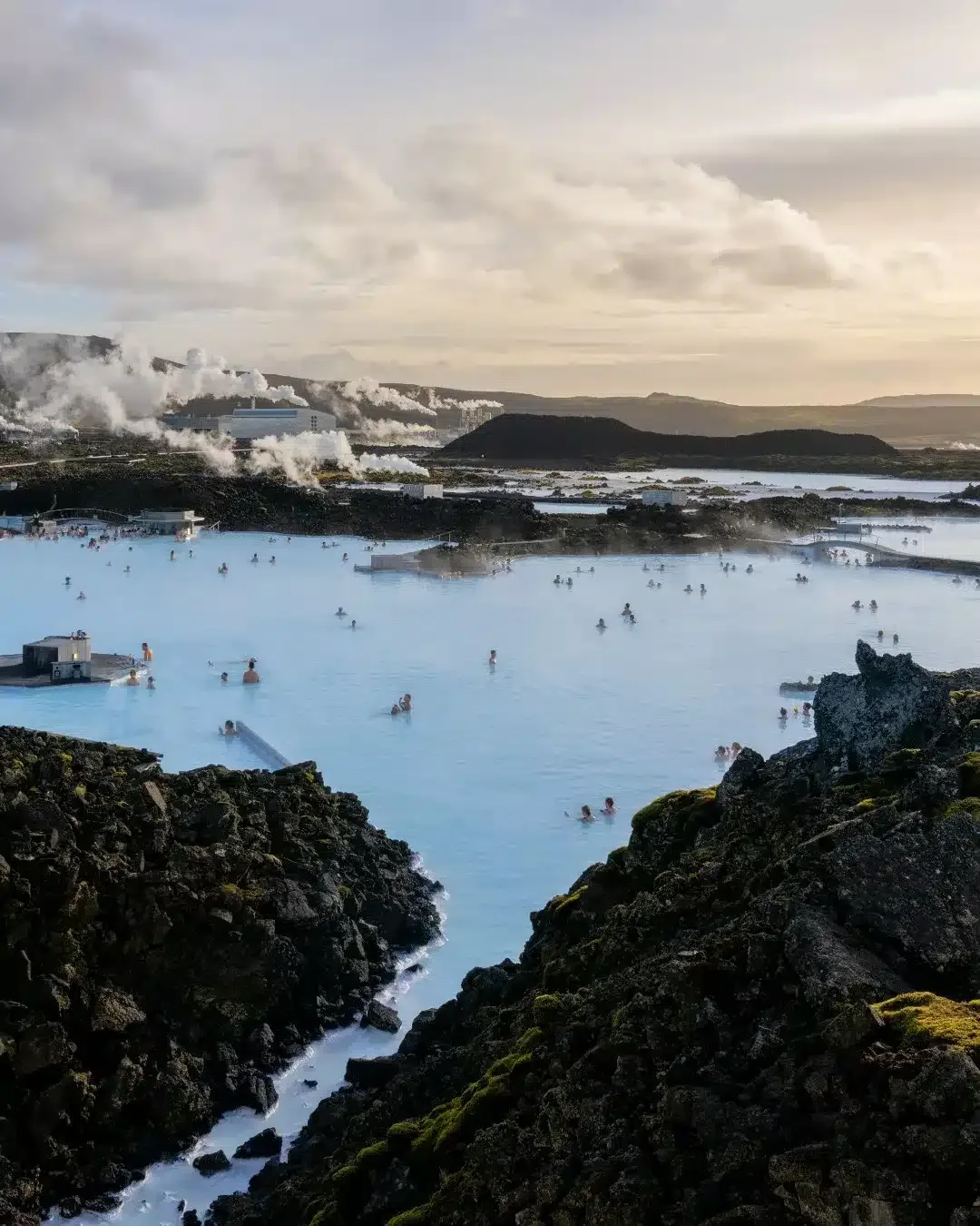 View of the lagoon with the Svartsengi geothermal power plant in the background