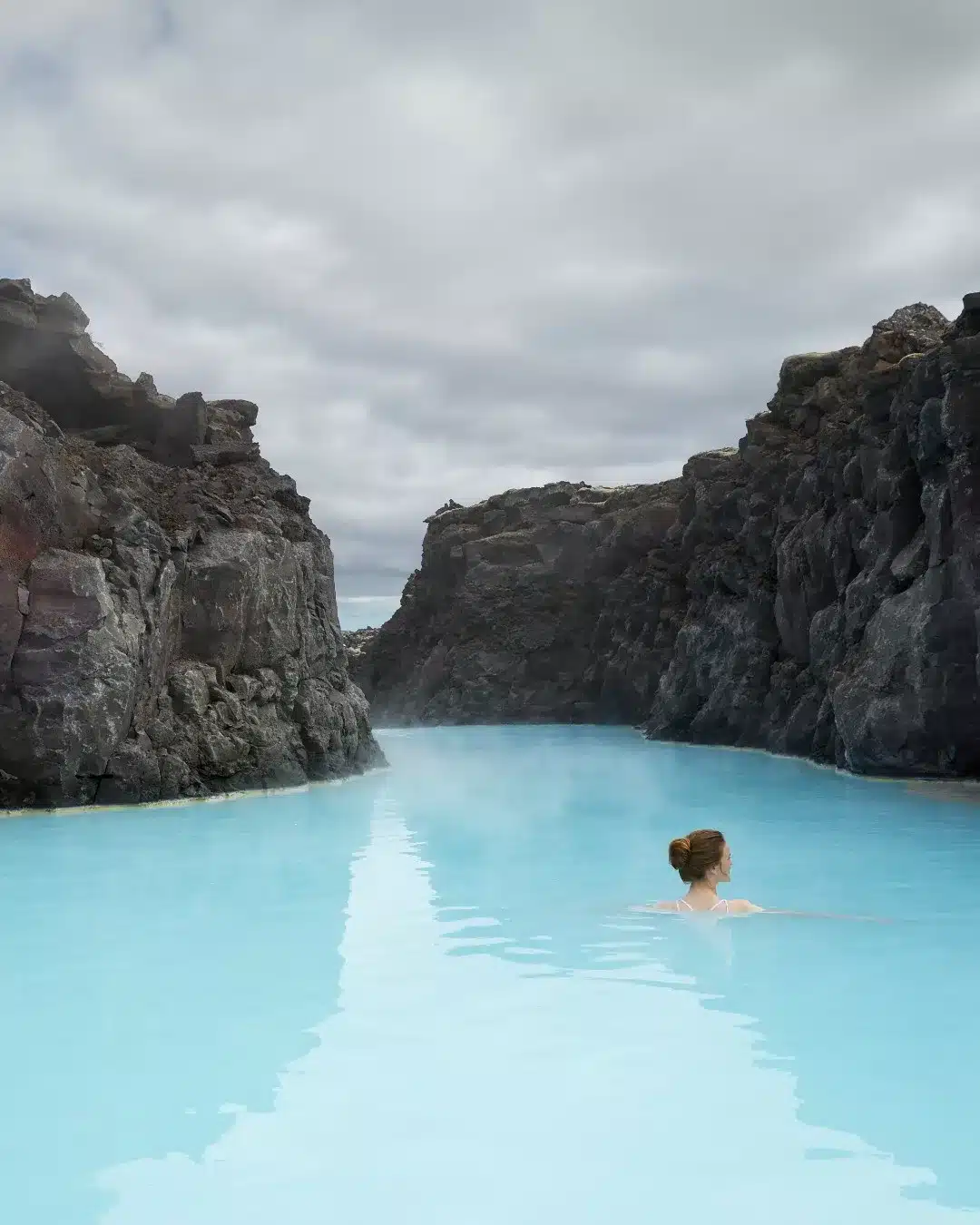 Steam rising from the warm waters of the Blue Lagoon at sunset